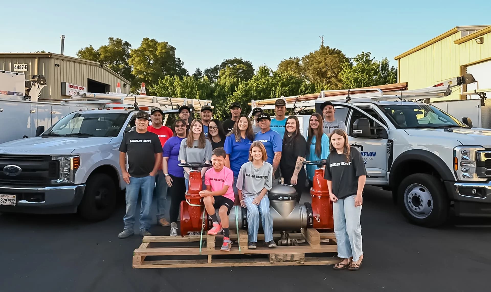 The All Pro Backflow, Inc. team in front of their service trucks in Rocklin, CA